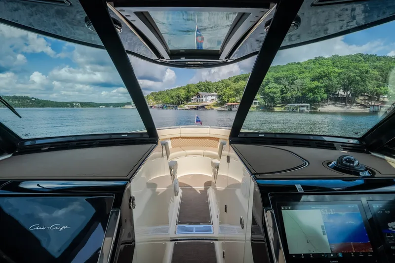 Slide: The Image of 2024 Chris-Craft Calypso 35 interior view, showcasing luxurious design and advanced navigation systems. - 43