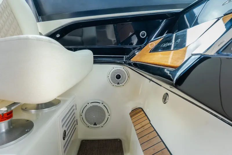 Slide: The Image of Interior of 2024 Chris-Craft Calypso 35 boat, featuring seating and speaker system. - 41