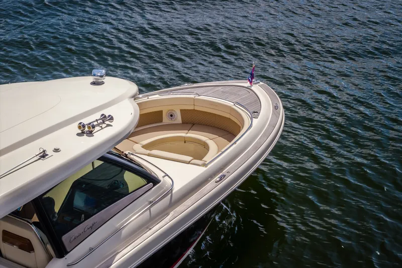 Slide: The Image of 2024 Chris-Craft Calypso 35 boat with elegant seating, cruising on calm waters. - 4