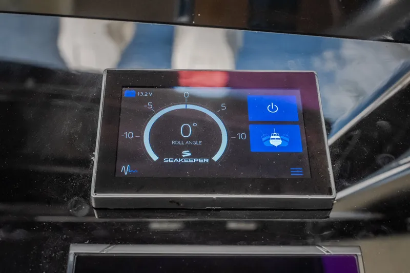 Slide: The Image of Seakeeper control display on 2024 Chris-Craft Calypso 35 boat, showing roll angle and power options. - 38