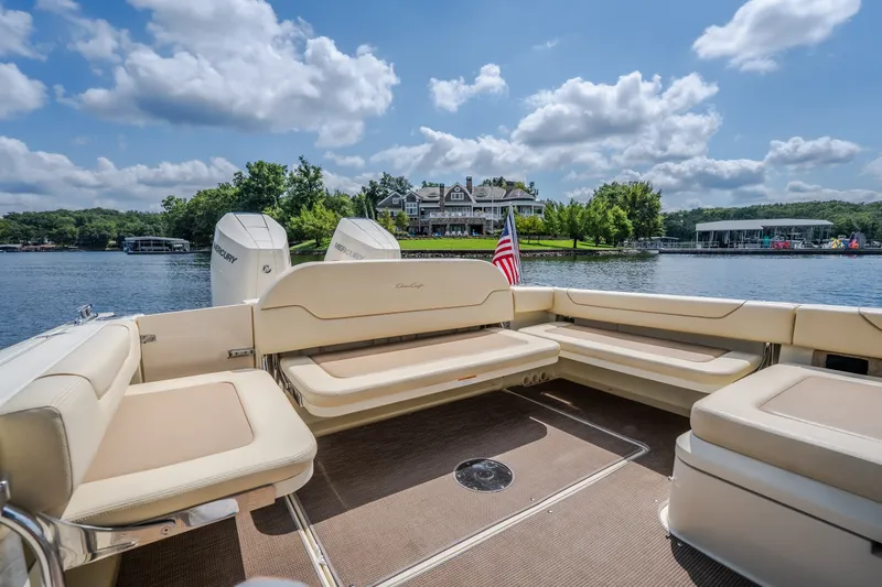 Slide: The Image of 2024 Chris-Craft Calypso 35 boat interior with lake view and luxury seating. - 12