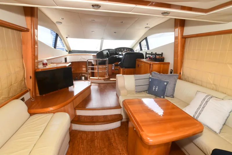 Slide: The Image of Luxurious interior of a 2006 Sunseeker Manhattan 50 yacht with elegant seating and helm. - 14