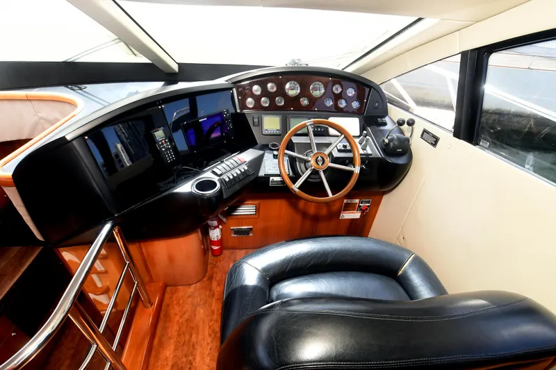 Slide: The Image of Luxurious helm of 2006 Sunseeker Manhattan 50 yacht with leather seating and modern controls. - 15