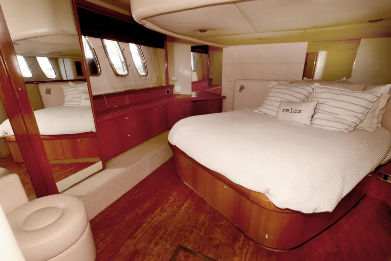 Slide: The Image of Luxurious bedroom interior of 2006 Sunseeker Manhattan 50 yacht with elegant wood finish. - 27