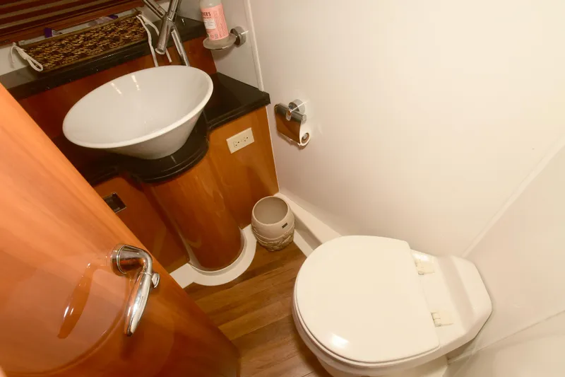 Slide: The Image of Bathroom interior of 2006 Sunseeker Manhattan 50 yacht, featuring sink and toilet. - 28