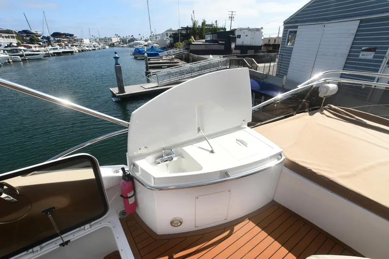 Slide: The Image of 2006 Sunseeker Manhattan 50 yacht deck with sink, docked in marina. - 34