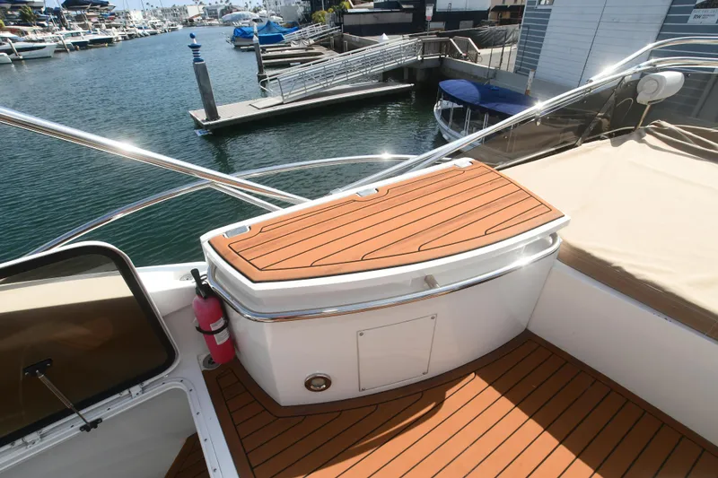 Slide: The Image of Sunseeker Manhattan 50 yacht deck with wooden flooring, docked at marina, 2006 model. - 35