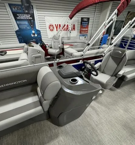 Slide: The Image of 2024 Bennington 20 SVSR boat interior seating with cup holders. - 10
