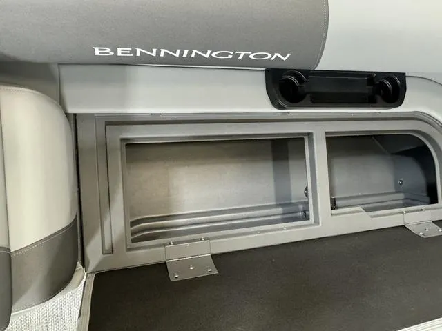 Slide: The Image of 2024 Bennington 20 SVSR boat storage compartment with sleek design and ample space. - 16