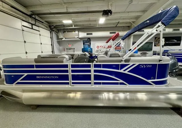 Slide: The Image of 2024 Bennington 20 SVSR boat dashboard with steering wheel and control panel. - 4