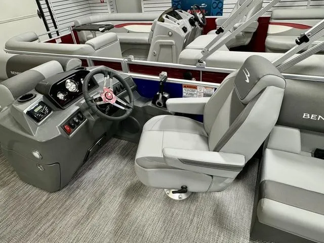 Slide: The Image of 2024 Bennington 20 SVSR pontoon boat interior with gray seating and carpet. - 7