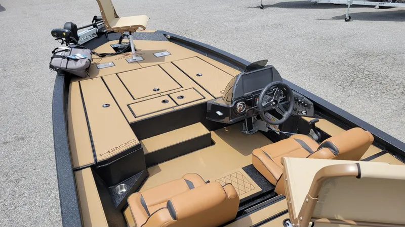 Slide: The Image of 2025 Xpress H20C Crappie boat interior with Yamaha Vmax 175, tan seating, and control panel. - 5