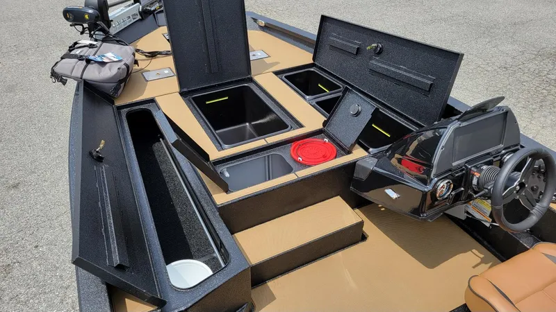 Slide: The Image of 2025 Xpress H20C Crappie boat interior with Yamaha Vmax 175, featuring storage compartments and steering console. - 6