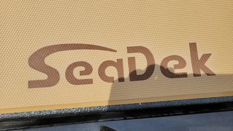Slide: The Image of SeaDek logo on textured surface of 2025 Xpress H20C Crappie boat. - 8