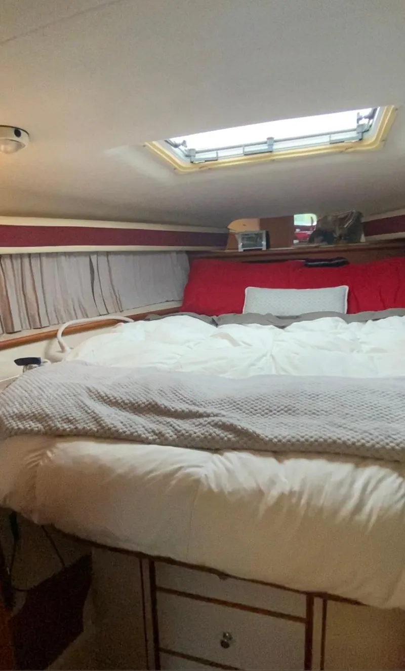 Slide: The Image of Cozy bedroom in a 1992 Regal Commodore 400 yacht with skylight. - 14