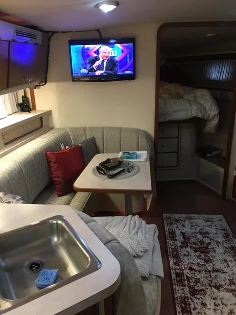 Slide: The Image of 1992 Regal Commodore 400 interior with TV, seating area, and sink. - 6