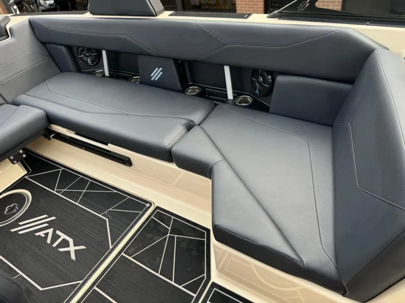 Slide: The Image of 2024 ATX Surf Boats 22 Type-S interior seating with sleek black upholstery and modern design. - 12