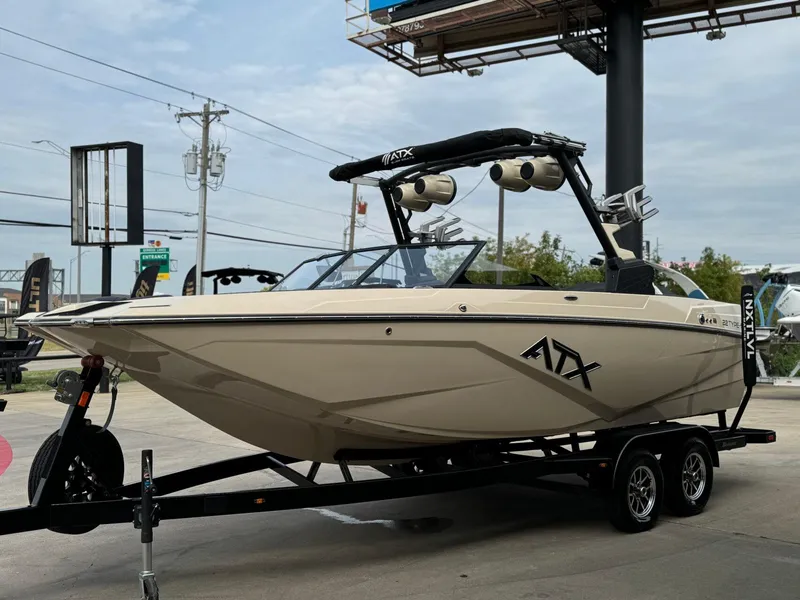 Slide: The Image of 2024 ATX Surf Boats 22 Type-S on trailer, displayed outdoors. - 7