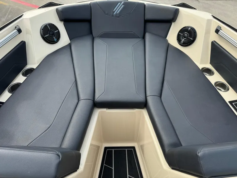 Slide: The Image of 2024 ATX Surf Boats 22 Type-S interior with black seating and cup holders. - 8