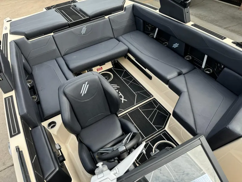 Slide: The Image of 2024 ATX Surf Boats 22 Type-S interior with sleek black seating and modern design. - 9