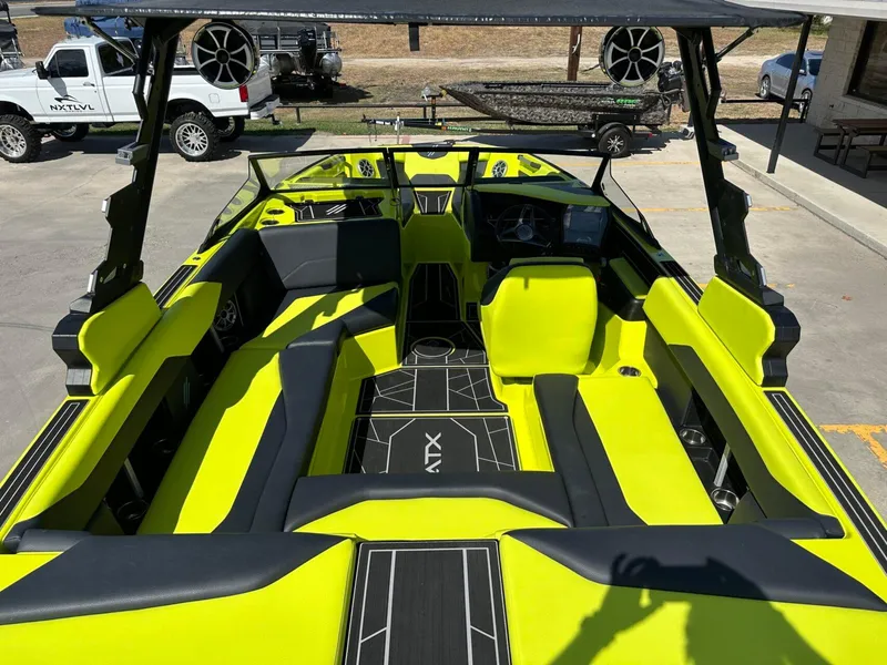 Slide: The Image of 2024 ATX Surf Boats 22 Type-S with vibrant lime green interior and sleek design. - 10