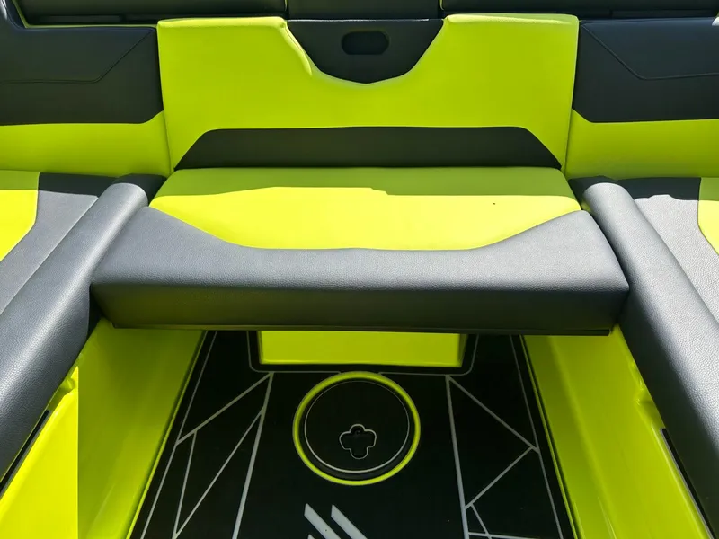 Slide: The Image of 2024 ATX Surf Boats 22 Type-S interior with vibrant lime green and black seating. - 12