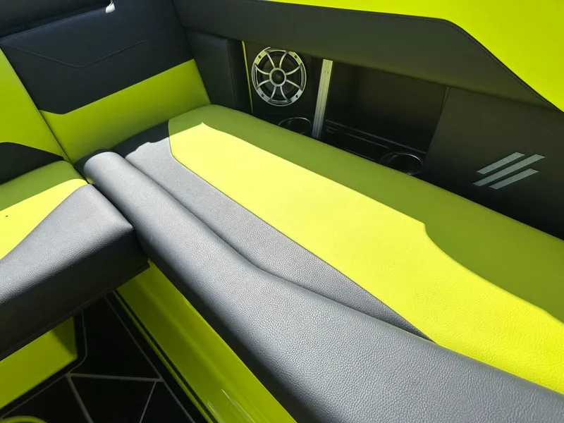 Slide: The Image of 2024 ATX Surf Boats 22 Type-S interior with vibrant yellow and black seating. - 13