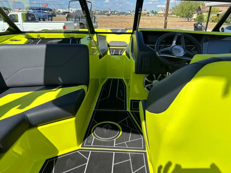 Slide: The Image of 2024 ATX Surf Boats 22 Type-S interior with vibrant yellow and black seating. - 15