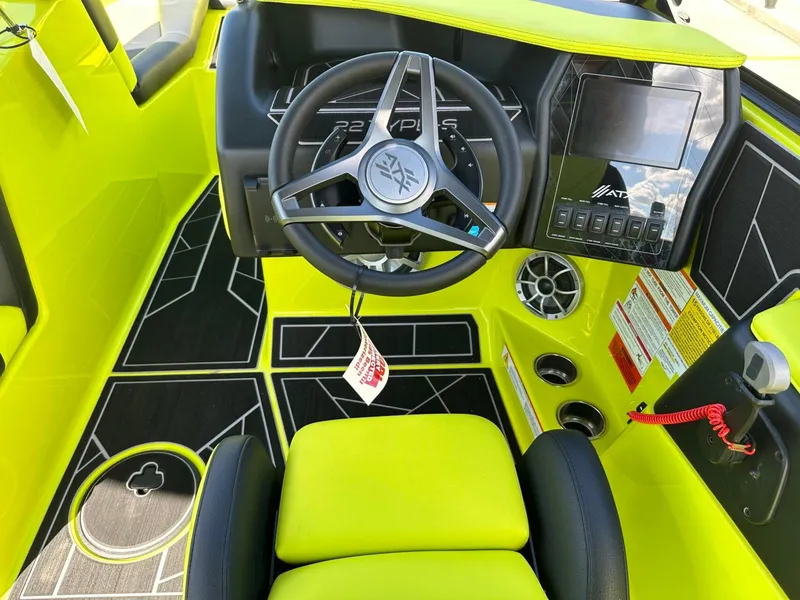 Slide: The Image of 2024 ATX Surf Boats 22 Type-S interior with vibrant yellow accents and modern dashboard. - 17