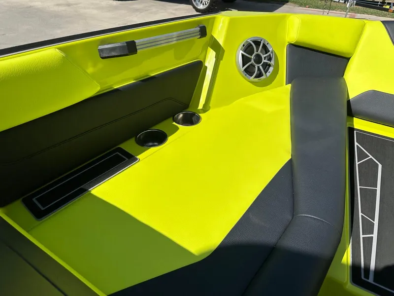 Slide: The Image of 2024 ATX Surf Boats 22 Type-S interior with vibrant yellow seating and speaker. - 18
