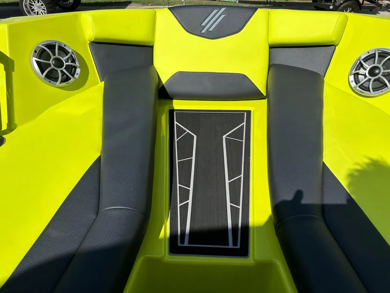 Slide: The Image of 2024 ATX Surf Boats 22 Type-S interior with vibrant yellow and black seating. - 19