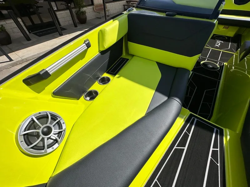 Slide: The Image of 2024 ATX Surf Boats 22 Type-S interior with vibrant lime green and black seating. - 21