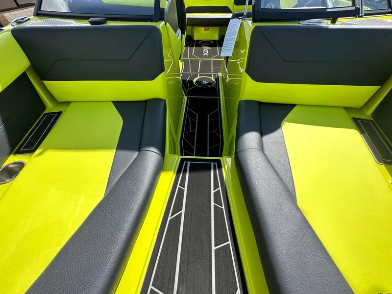 Slide: The Image of 2024 ATX Surf Boats 22 Type-S interior with vibrant yellow and black seating. - 22