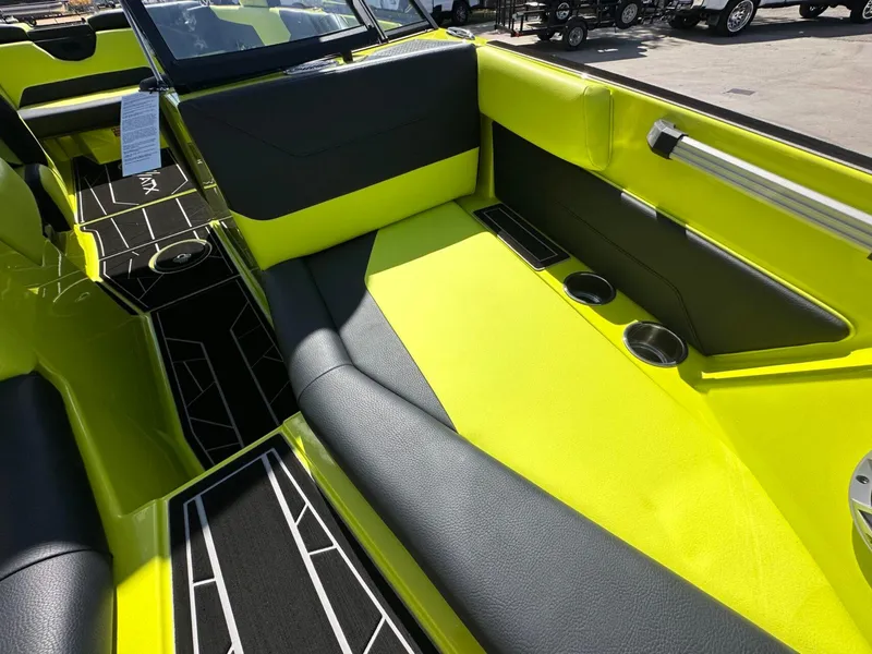 Slide: The Image of 2024 ATX Surf Boats 22 Type-S interior with vibrant yellow and black seating. - 23