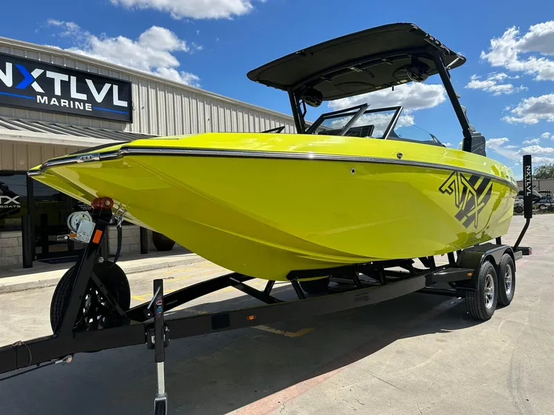 Slide: The Image of 2024 ATX Surf Boats 22 Type-S in vibrant yellow at NXT LVL Marine dealership. - 8