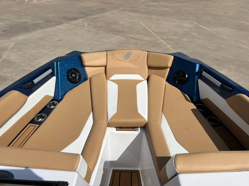 Slide: The Image of 2024 ATX Surf Boats 24 Type-S interior with tan and white seating. - 16