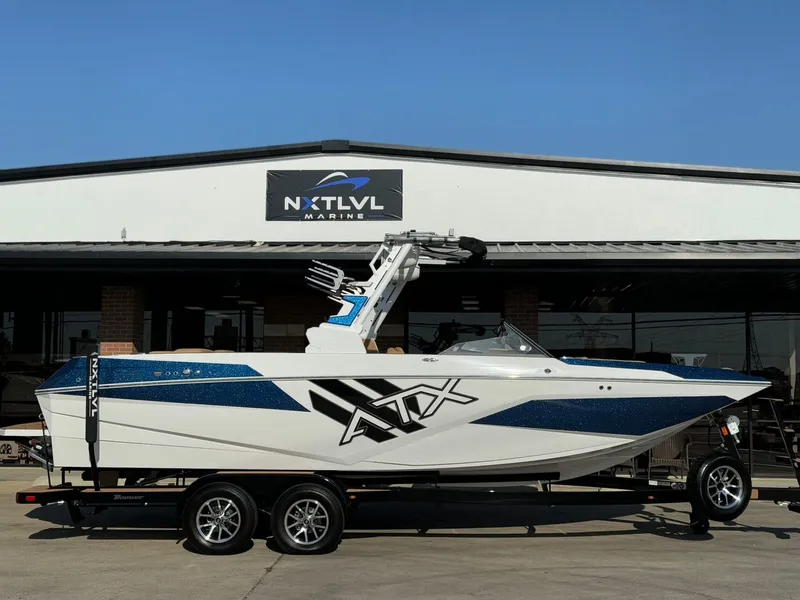 Slide: The Image of 2024 ATX Surf Boats 24 Type-S displayed at NXT LVL Marine dealership. - 2