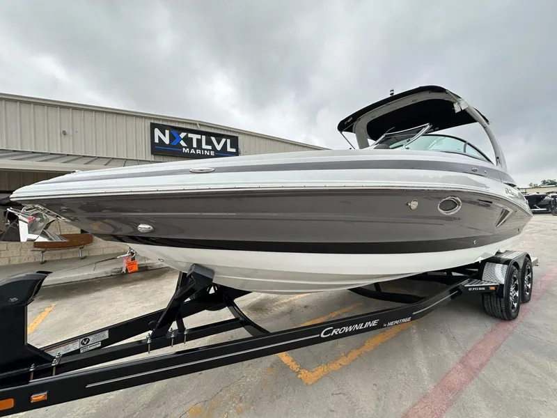 Slide: The Image of 2024 Crownline 270 SS boat on trailer at NXT LVL Marine dealership. - 24