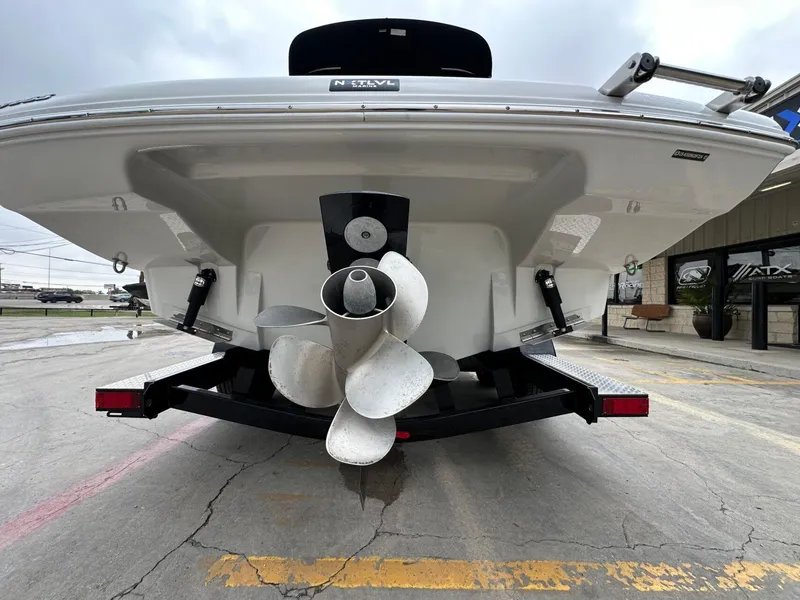 Slide: The Image of 2024 Crownline 270 SS boat rear view with propeller and trailer. - 25