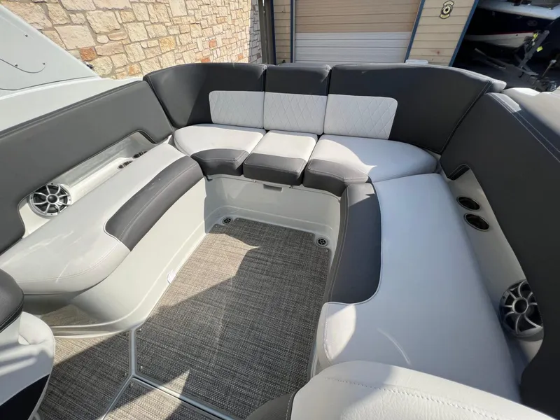 Slide: The Image of 2024 Crownline 270 SS boat interior with spacious seating and modern design. - 6