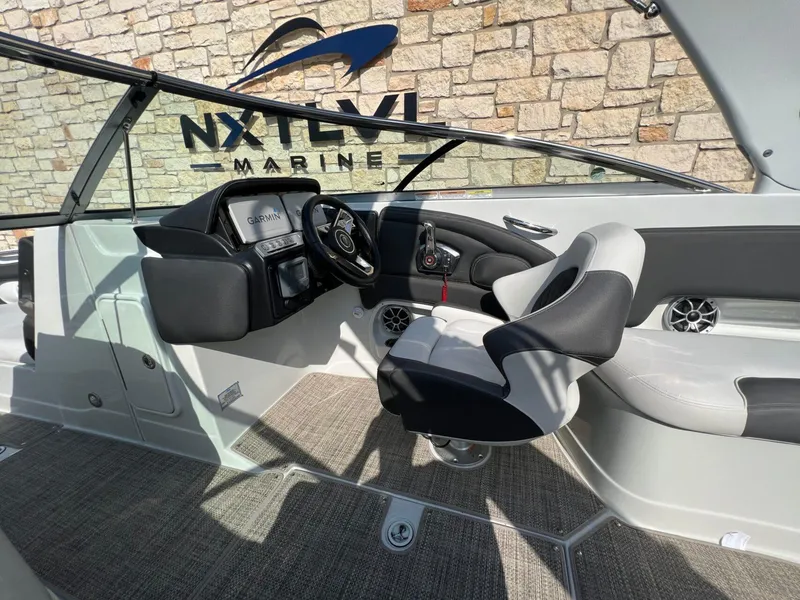 Slide: The Image of 2024 Crownline 270 SS boat interior with modern dashboard and steering wheel. - 7