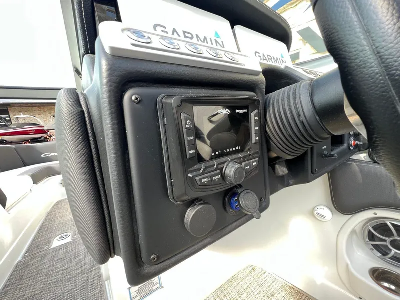 Slide: The Image of 2024 Crownline 270 SS dashboard featuring Garmin navigation and Wet Sounds audio system. - 9