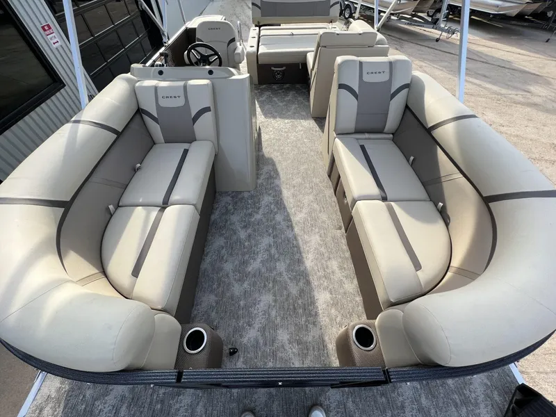 Slide: The Image of 2023 Crest Classic LX 220 SLS pontoon boat with spacious seating and modern design. - 10