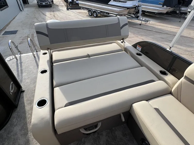 Slide: The Image of 2023 Crest Classic LX 220 SLS boat with spacious seating and cup holders. - 24