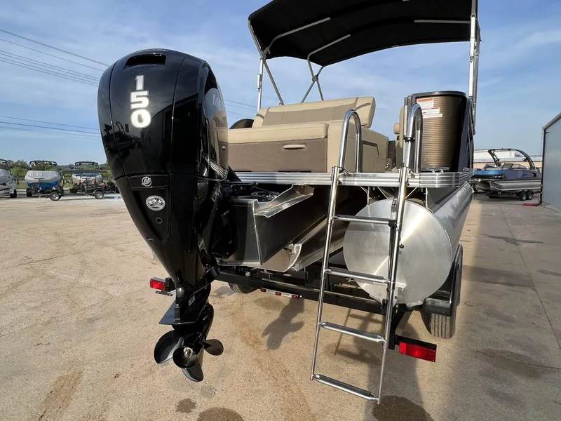 Slide: The Image of 2023 Crest Classic LX 220 SLS pontoon boat with 150 HP engine and ladder. - 3