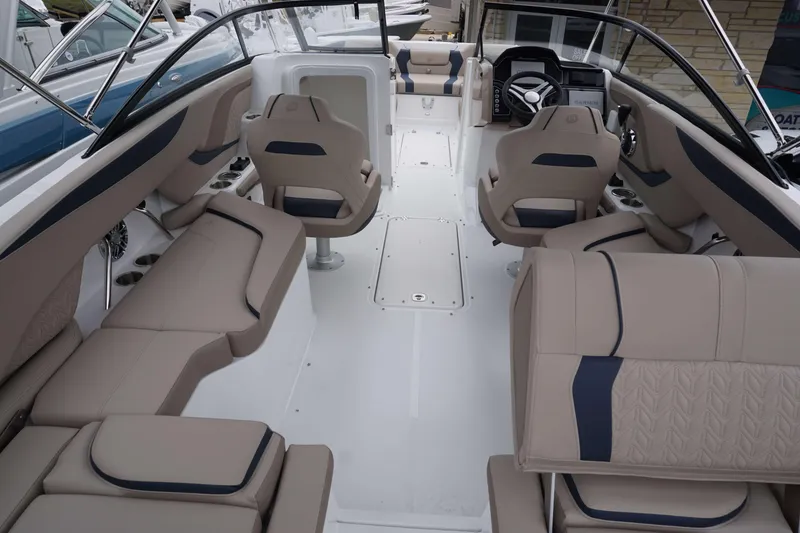 Slide: The Image of Interior of 2024 Hurricane 2600 SD boat with beige and navy seating. - 11