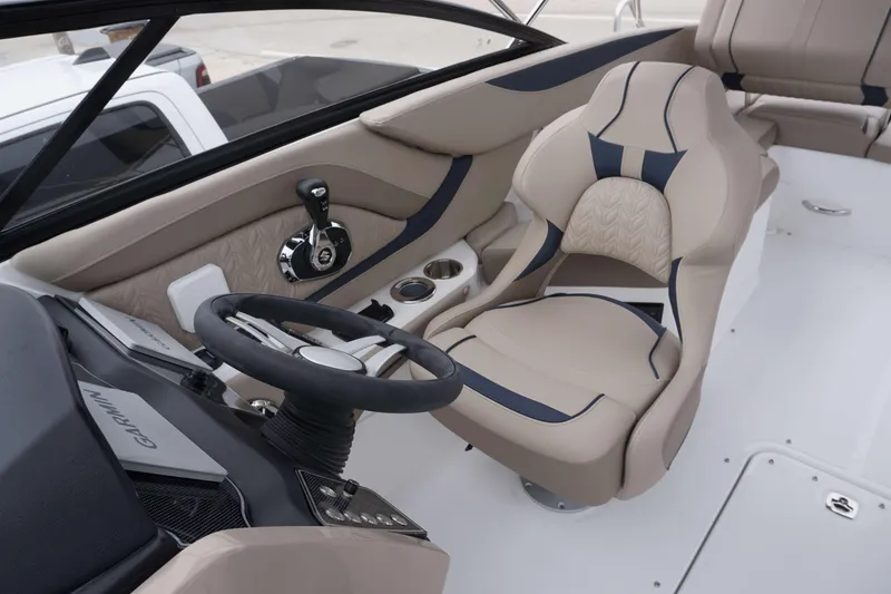 Slide: The Image of 2024 Hurricane 2600 SD boat interior with steering wheel and captain's seat. - 15