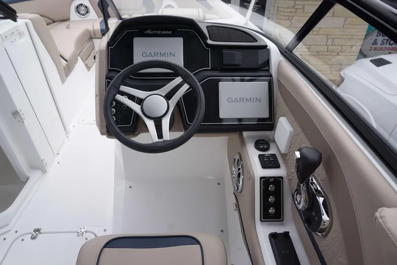 Slide: The Image of 2024 Hurricane 2600 SD boat dashboard with Garmin navigation system and steering wheel. - 4