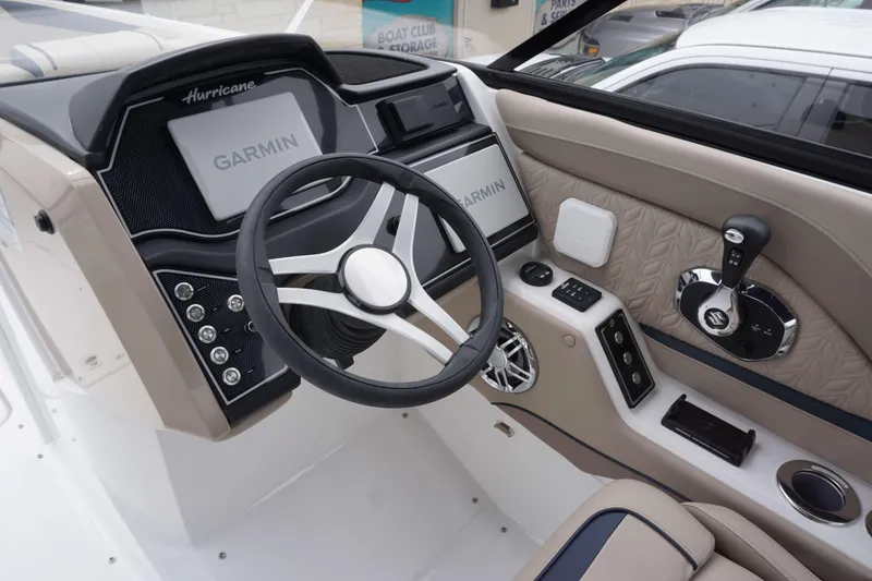 Slide: The Image of 2024 Hurricane 2600 SD boat dashboard with Garmin navigation system and modern controls. - 5