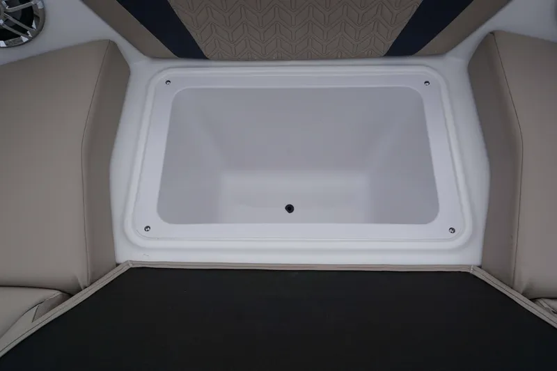 Slide: The Image of 2024 Hurricane 2600 SD boat storage compartment with cushioned seating. - 6
